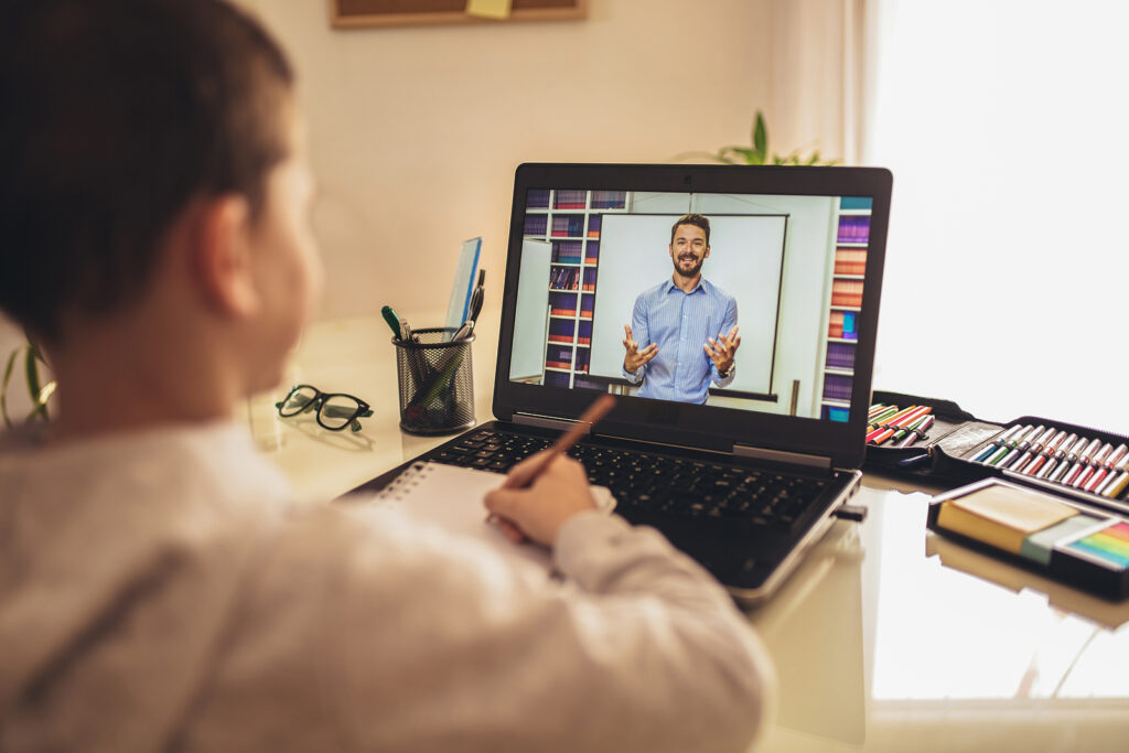Distance Learning Online Education. A Schoolboy Boy Studies At H (jovanmandic/BigStock)