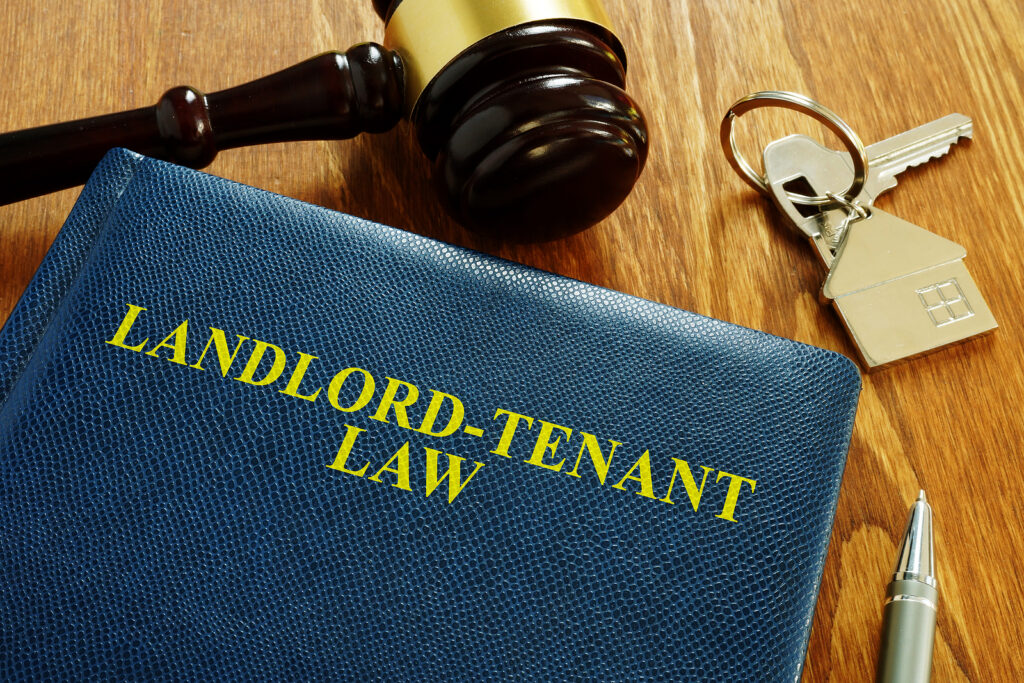 Landlord Tenant Law Book And Key From Home. Landlord Tenant Law book and key from home. (Courtesy of BigStock)