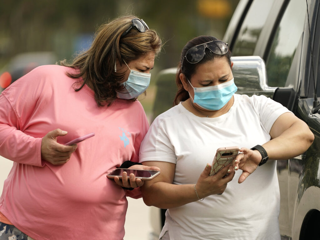 Women wear masks in Houston on Wednesday. Harris County requires any business providing goods or services to require all employees and visitors to wear face coverings in areas of close proximity to co-workers or the public, at least through Aug. 26. Women wear masks in Houston on Wednesday. Harris County requires any business providing goods or services to require all employees and visitors to wear face coverings in areas of close proximity to co-workers or the public, at least through Aug. 26.