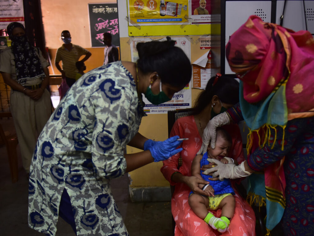Medical staff in Mumbai, India, last week. A U.N. report warns that the coronavirus pandemic is interfering with children getting vaccinated. Medical staff in Mumbai, India, last week. A U.N. report warns that the coronavirus pandemic is interfering with children getting vaccinated. (Anshuman Poyrekar/Hindustan Times via Getty Images)