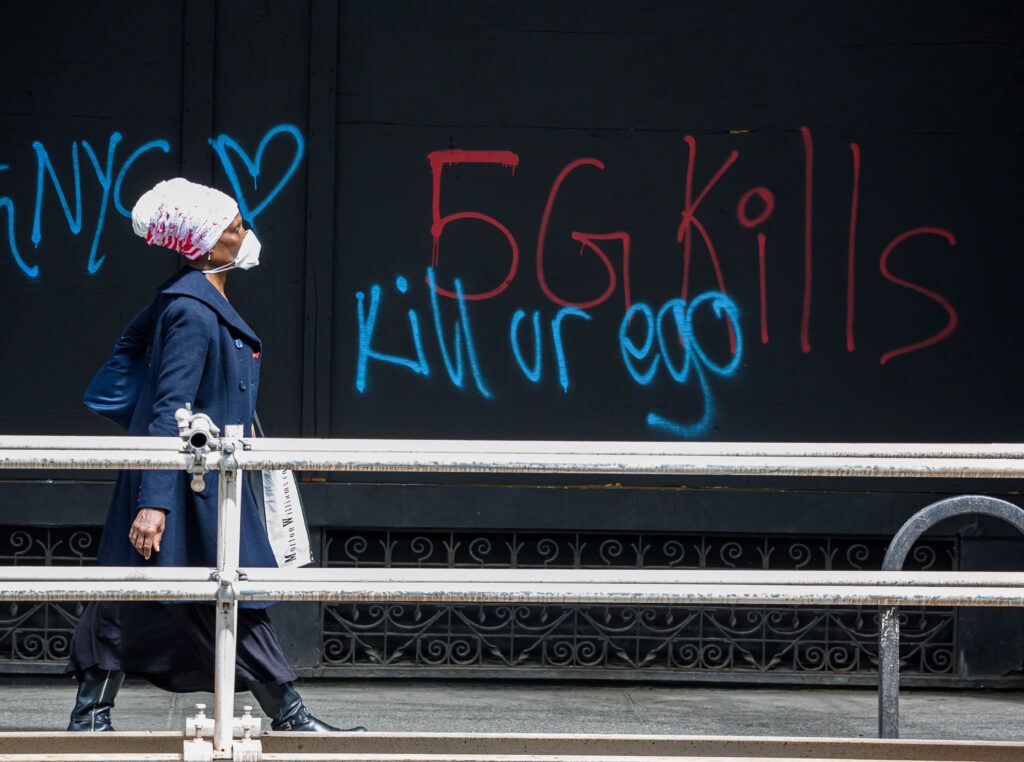 A pedestrian walks past anti-5G graffiti in the Flatiron District of New York in May. A pedestrian walks past anti-5G graffiti in the Flatiron District of New York in May. (Noam Galai/Getty Images)