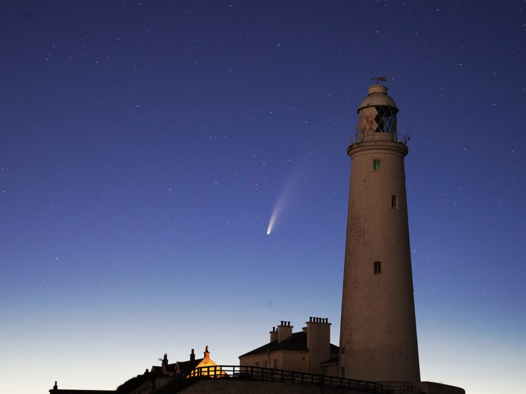 Comet Neowise passes St Mary’s Lighthouse in Whitley Bay, UK in the early hours of Tuesday morning. Comet Neowise passes St Mary's Lighthouse in Whitley Bay, UK in the early hours of Tuesday morning. (Owen Humphreys - PA Images/PA Images via Getty Images)