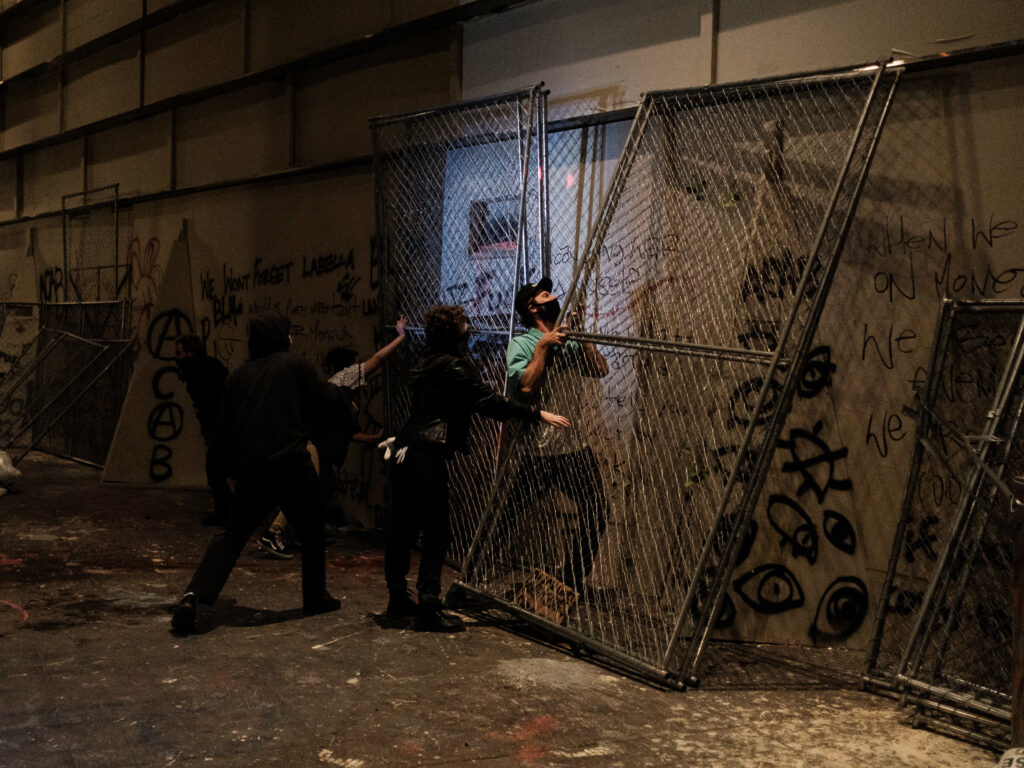 Protestors attempt to barricade the entrance to the U.S. District Court building on July 17, 2020 in Portland, Oregon. Protestors attempt to barricade the entrance to the U.S. District Court building on July 17, 2020 in Portland, Oregon.