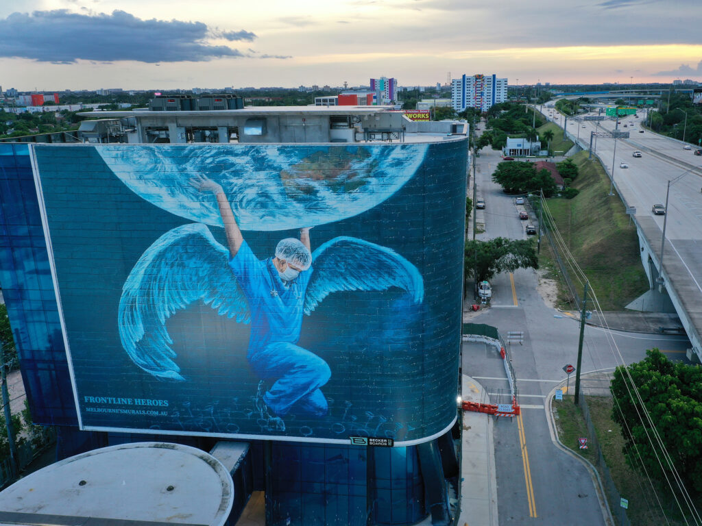 A billboard in Miami — where coronavirus cases continue to surge — depicts a medical worker holding up the world. The number of coronavirus deaths worldwide has surpassed 600,000, with more than 140,000 of those in the U.S. A billboard in Miami — where coronavirus cases continue to surge — depicts a medical worker holding up the world. The number of coronavirus deaths worldwide has surpassed 600,000, with more than 140,000 of those in the U.S.