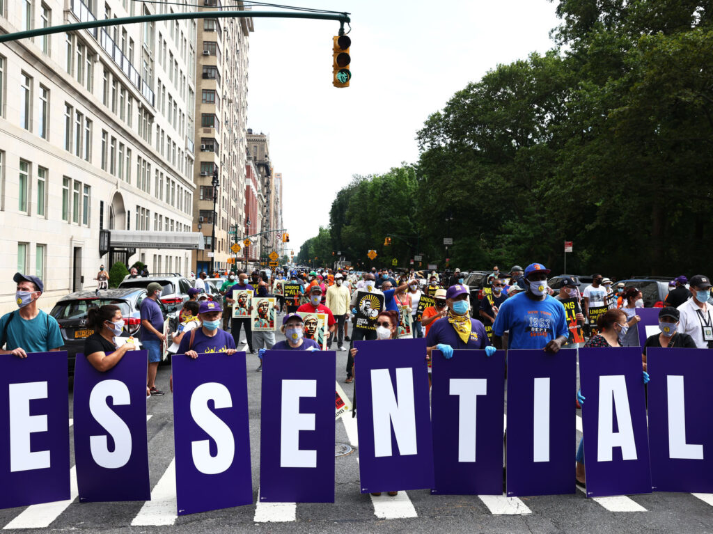 Members of the 32BJ union participate in a “Strike for Black Lives” rally in New York City, one of the many demonstrations for racial and economic justice that took place across the U.S. on Monday. Members of the 32BJ union participate in a