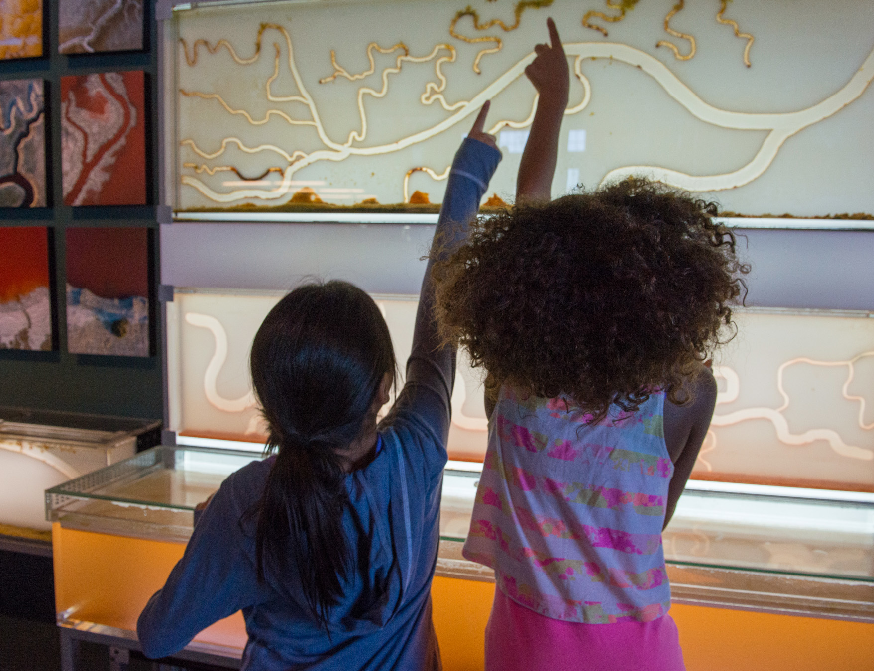 Children examine a salt marsh exhibition at San Francisco's Exploratorium before the coronavirus pandemic.