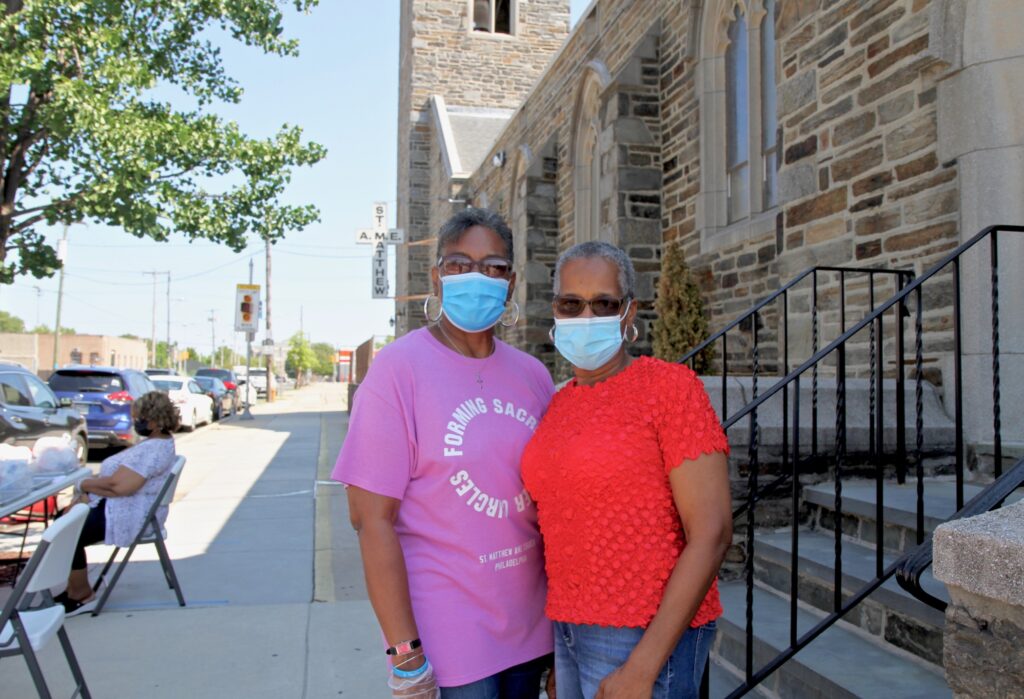 2020 08 05-x conde-lethonia dennison beatrice sims-west philadelphia haddington-philly counts census workers Lethonia Dennison and Beatrice Sims are ministers at St. Matthew AME Church, and have been giving out census information with free meals for those affected by COVID-19. (Ximena Conde/WHYY)