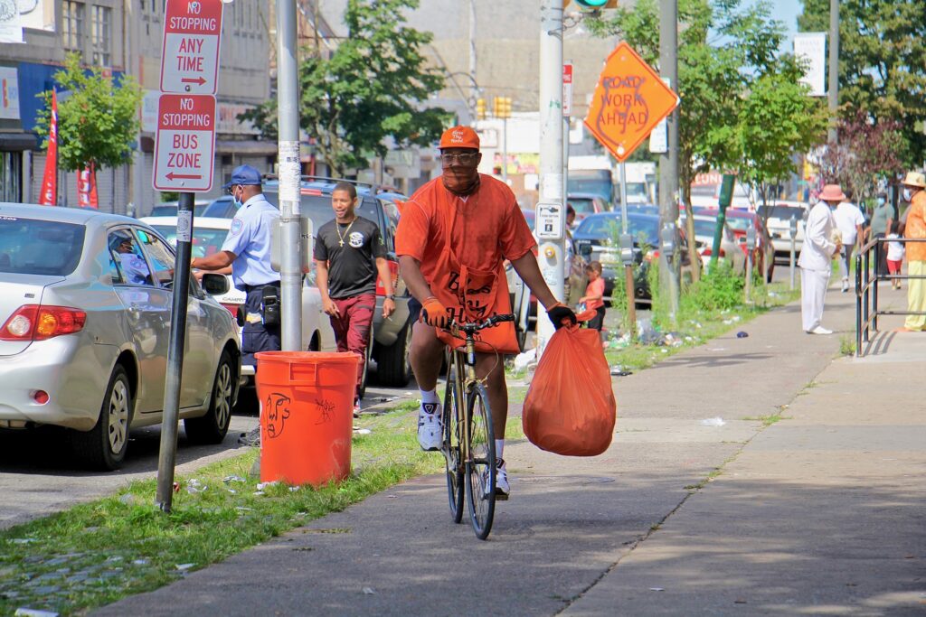 Matthew George collects trash on Chelten Avenue