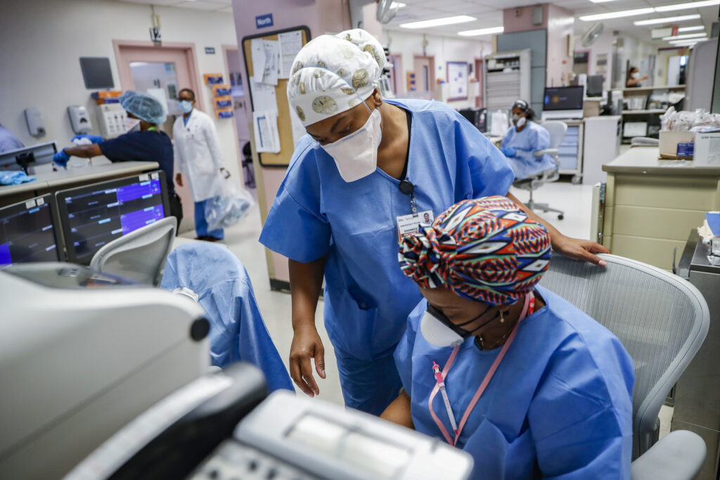 Virus Outbreak Healing Health Workers Medical personnel work in the emergency department at NYC Health + Hospitals Metropolitan