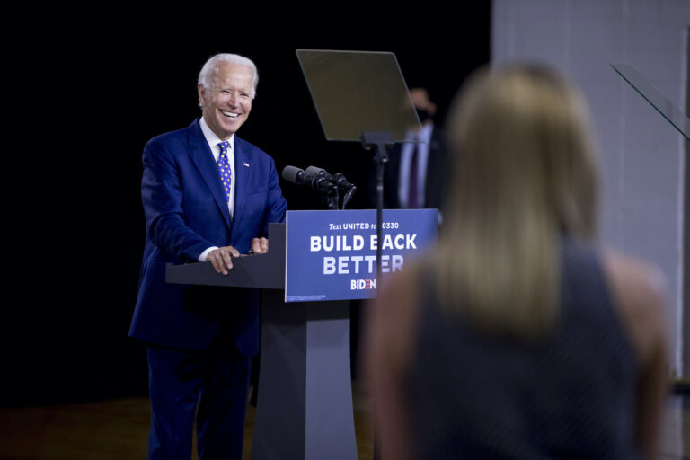 Democratic presidential candidate former Vice President Joe Biden smiles as he takes a question from a reporter at a campaign event at the William 