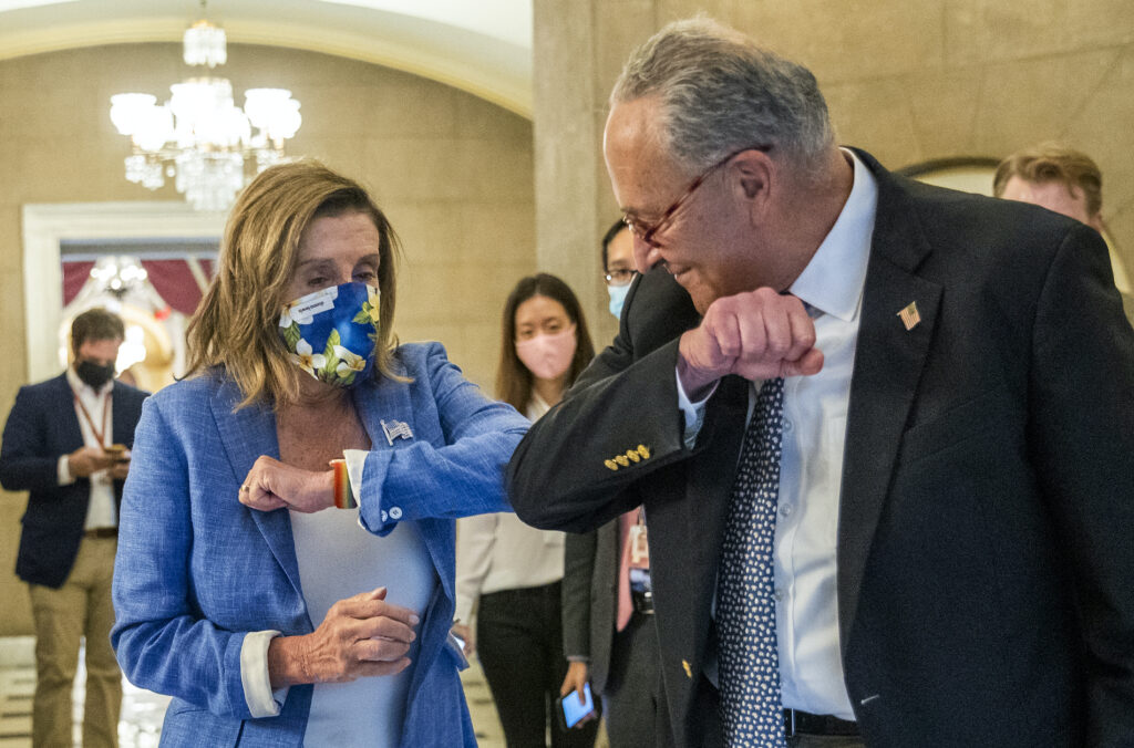 Nancy Pelosi, Chuck Schumer House Speaker Nancy Pelosi of Calif., gives Senate Minority Leader Chuck Schumer of N.Y., an elbow bump as Schumer leaves following a meeting at the Capitol with White House chief of staff Mark Meadows and Treasury Secretary Steven Mnuchin on a COVID-19 relief bill, Saturday, Aug. 1, 2020, in Washington. (AP Photo/Manuel Balce Ceneta)