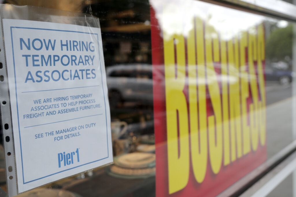 Virus Outbreak Florida A sign advertises hiring of temporary associates at a Pier 1 retail store, which is going out of business, during the coronavirus pandemic, Thursday, Aug. 6, 2020, in Coral Gables, Fla. (AP Photo/Lynne Sladky)