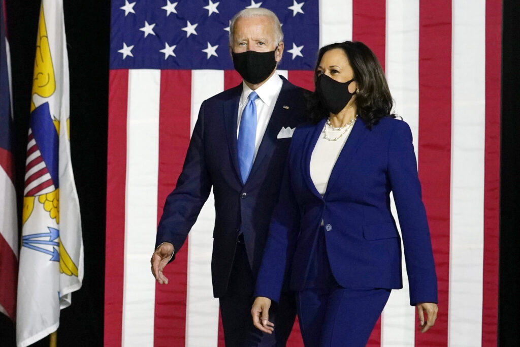 Joe Biden, Kamala Harris Democratic presidential candidate former Vice President Joe Biden and his running mate Sen. Kamala Harris, D-Calif., arrive to speak at a news conference at Alexis Dupont High School in Wilmington, Del., Wednesday, Aug. 12, 2020. (AP Photo/Carolyn Kaster)