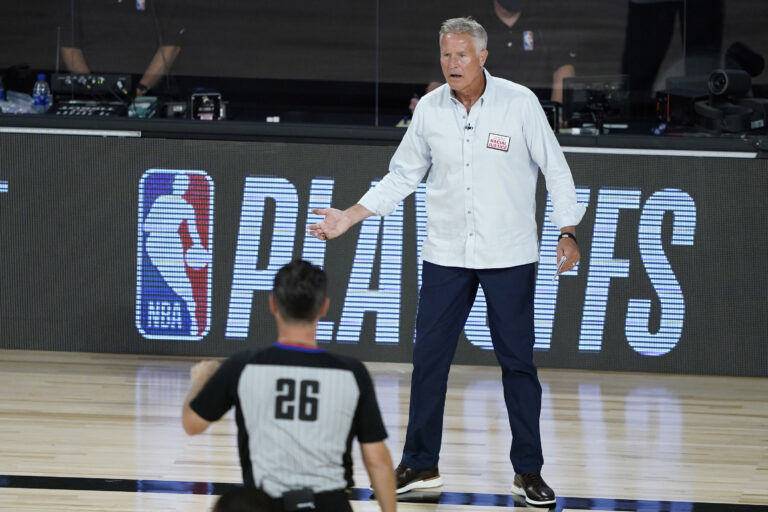 Philadelphia 76ers head coach Brett Brown looks to an official during the first half of an NBA basketball first round playoff game against the Boston Celtics Monday, Aug. 17, 2020, in Lake Buena Vista, Fla. (AP Photo/Ashley Landis, Pool)