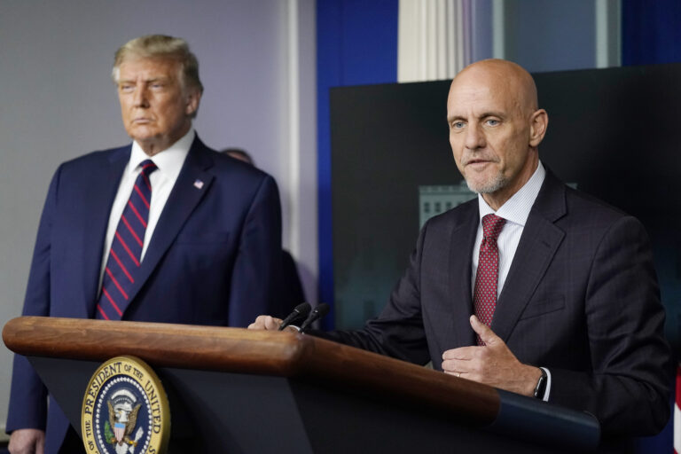 President Donald Trump listens as Dr. Stephen Hahn, commissioner of the U.S. Food and Drug Administration, speaks during a media briefing in the James Brady Briefing Room of the White House, Sunday, Aug. 23, 2020, in Washington.(AP Photo/Alex Brandon)