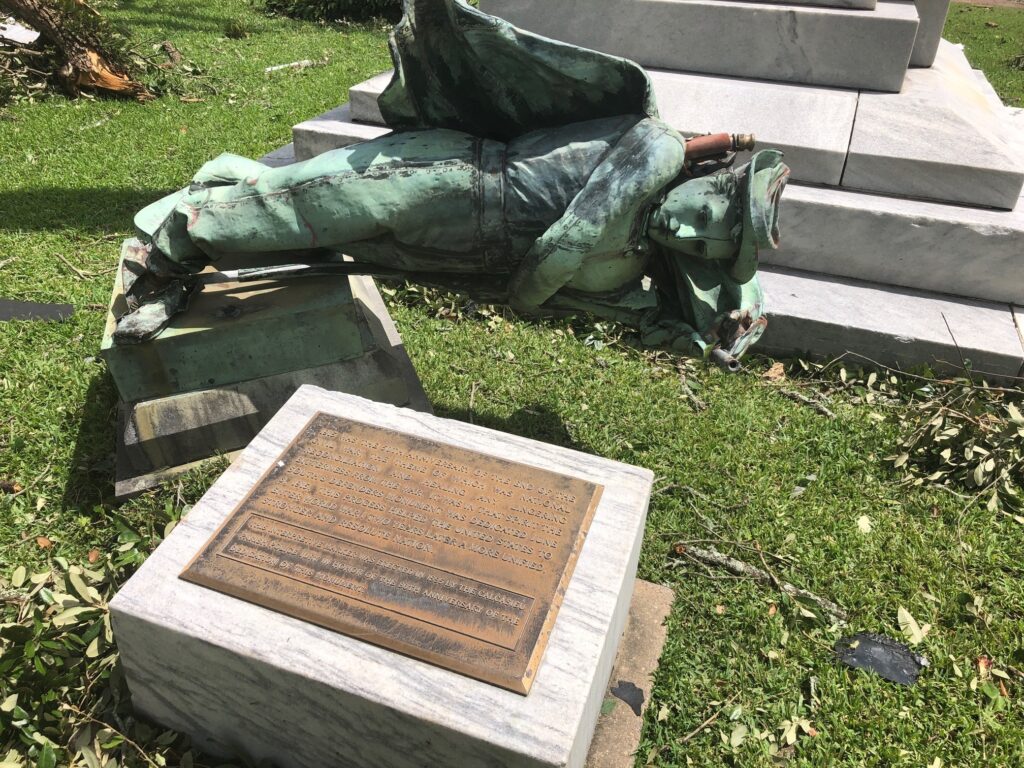 Tropical Weather A statue of a Confederate soldier in front of a courthouse in Lake Charles, La., lies on the ground Thursday Aug. 27, 2020 after being toppled when Hurricane Laura ripped through the area. Earlier this month parish officials voted to keep the statue, called the South’s Defenders Monument, in its place. (AP Photo/Melinda Deslatte)