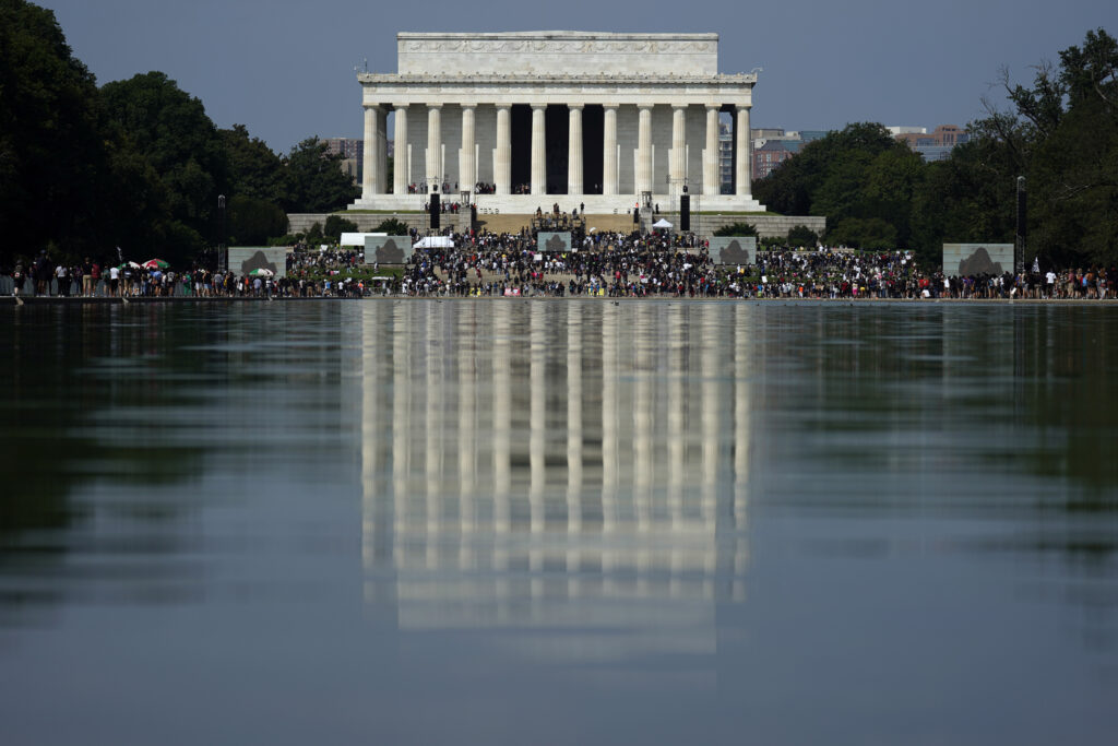APTOPIX Racial Injustice March On Washington The Lincoln Memorial is reflected in the water as people gather to attend the March on Washington, Friday Aug. 28, 2020, in Washington, on the 57th anniversary of the Rev. Martin Luther King Jr.'s