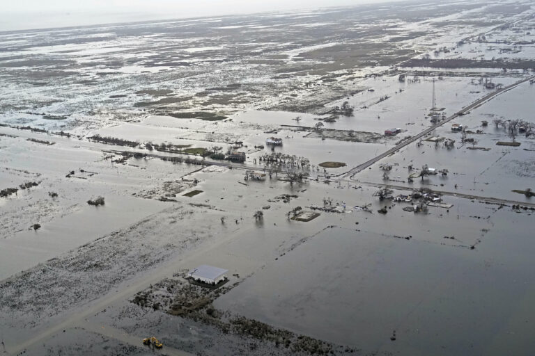 State Highway 27 leading to Cameron, La. is seen in Creole, La., Friday, Aug. 28, 2020, as the storm surge recedes in the aftermath of Hurricane Laura. (AP Photo/Gerald Herbert)