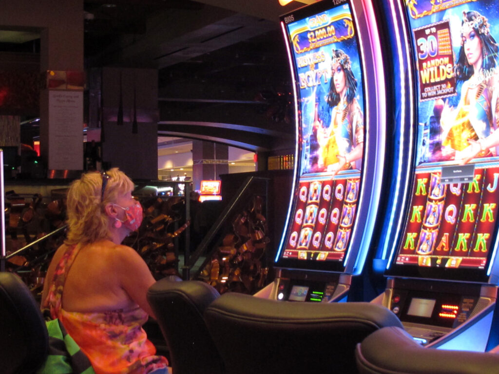 AP_atlantic_city_casino_coronavirus_082520 A woman plays a slot machine at the Golden Nugget casino in Atlantic City