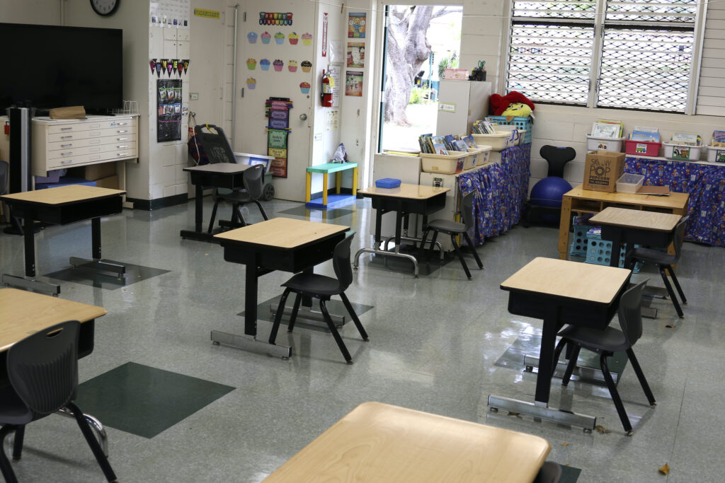 Desks are spaced out in a classroom Desks are spaced out in a classroom