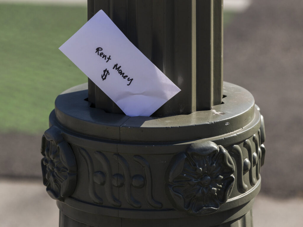 Rent money A paper envelope written with the words