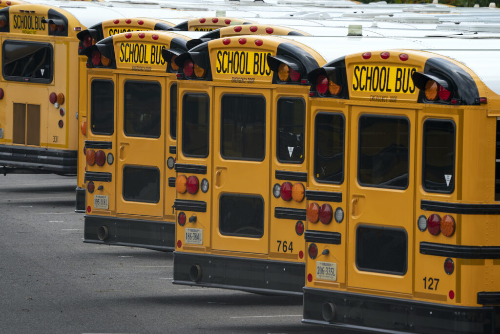Virus Outbreak Schools Reopening Fairfax County Public School buses are lined up at a maintenance facility