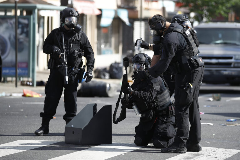Police deploy tear gas to disperse a crowd during protests