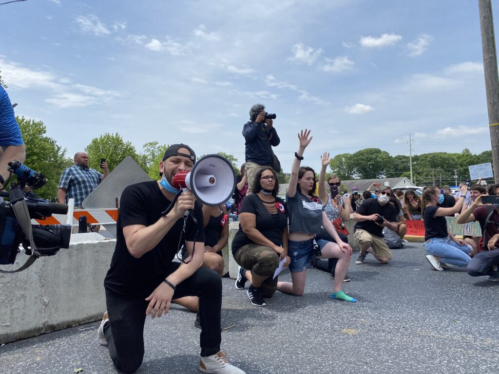 Abigail Amaury Abreu speaks about George Floyd, his own faith, and the need for action outside Lebanon's municipal building in June. (Alanna Elder/Keystone Crossroads)