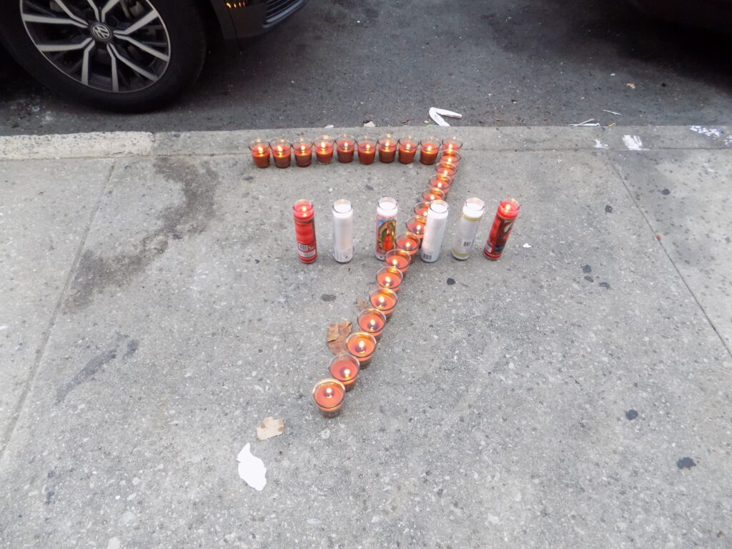 DSCN5717 Zamar Jones' neighbors placed candles, balloons, and roses in front of his home in early August. (Ximena Conde/WHYY)