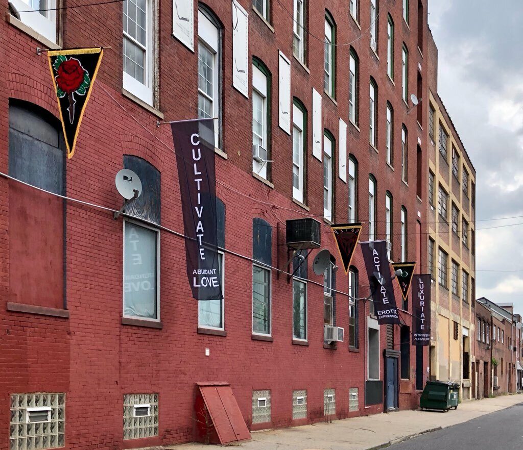 FullSizeR2 Flags that celebrate 100 year anniversary of Marcus Garvey's Pan-African flag created by artist Heather Raquel Phillips hanging outside the Practice Gallery at 319 11th St. in Philadelphia