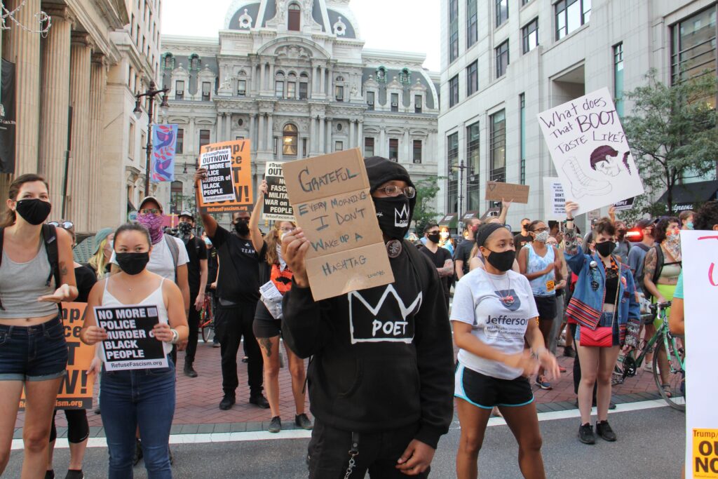 Image from iOS (125) Protesters march south on Broad Street after a rally at City Hall demanding justice for Jacob Blake, a Black man who was shot by police in Kenosha, Wisconsin. (Emma Lee/WHYY)