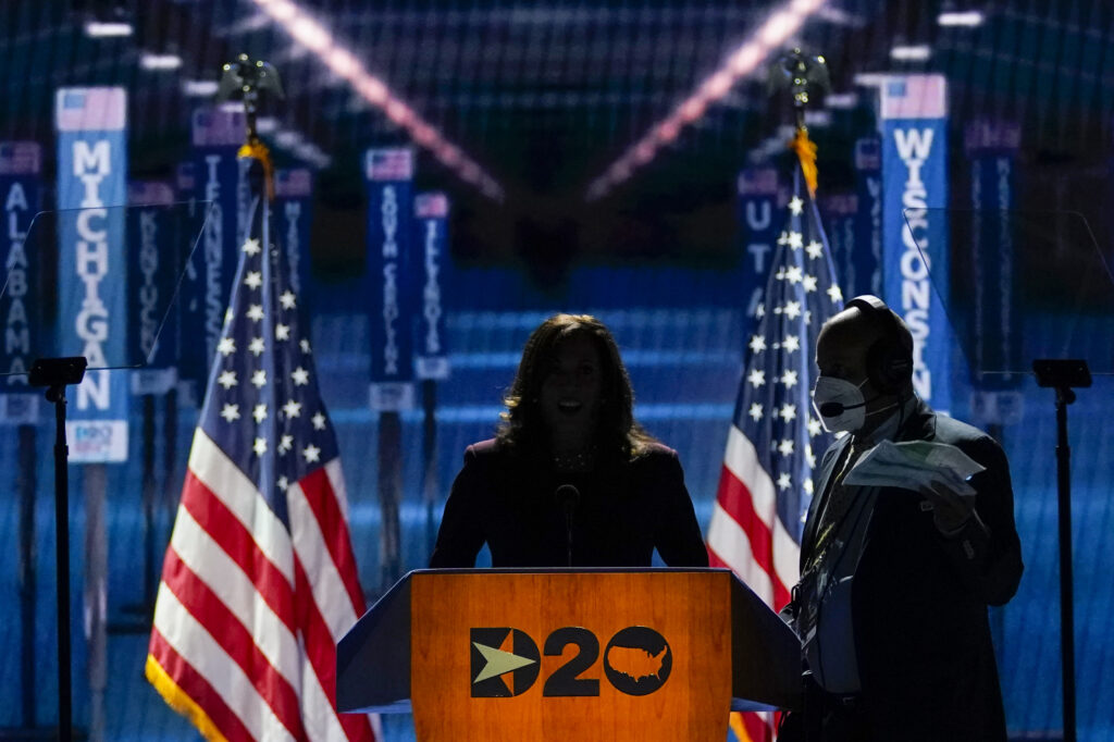 Kamala Harris Democratic vice presidential candidate Sen. Kamala Harris, D-Calif., takes her place at the podium to speak before the light go up on stage during the third day of the Democratic National Convention, Wednesday, Aug. 19, 2020, at the Chase Center in Wilmington, Del. (AP Photo/Carolyn Kaster)