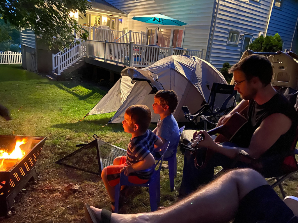 folk_fest_ llama_081320_03 Llama camper Matt Diamondstein plays guitar in Robert Bralows backyard
