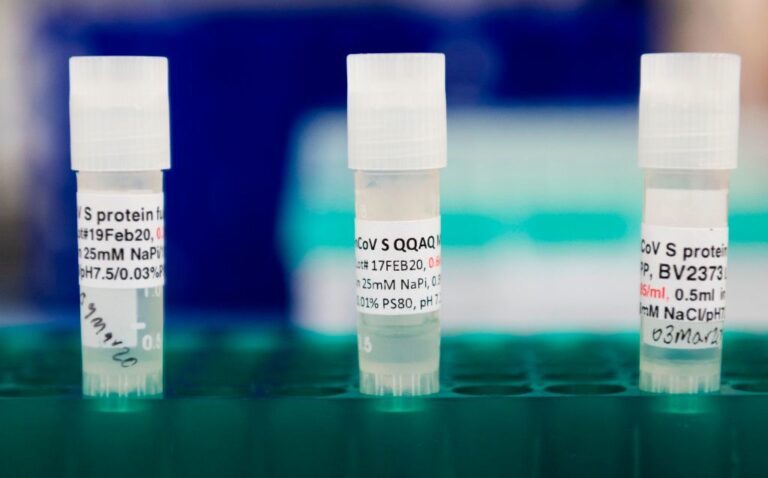 Potential COVID-19 vaccines are kept in a tray at Novavax labs in Maryland on March 20. The Novavax vaccine requires an immune-boosting ingredient called an adjuvant to be effective. (Andrew Caballero-Reynolds/AFP via Getty Images)