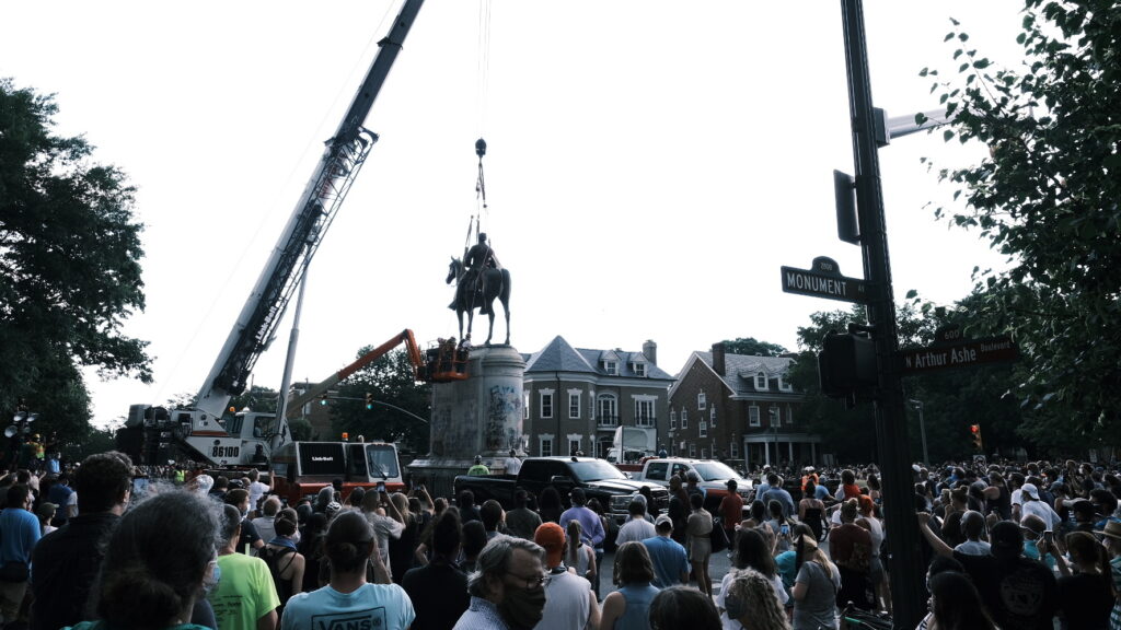 A crowd watches as a crane removes the Stonewall Jackson Monument in Richmond, Va., on July 1. Dozens of Confederate monuments have come down this summer. A crowd watches as a crane removes the Stonewall Jackson Monument in Richmond, Va., on July 1. Dozens of Confederate monuments have come down this summer. (Eze Amos/Getty Images)