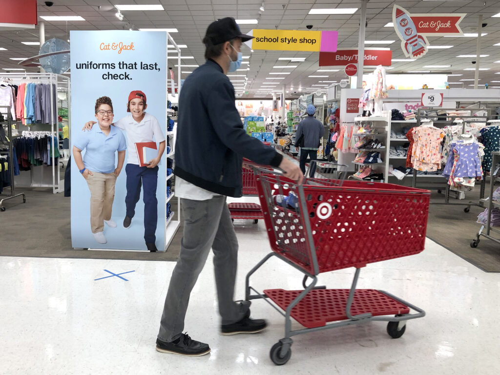 As Congress debates whether to renew supplemental unemployment benefits for people thrown out of work by the pandemic, new research shows those benefits offer a critical boost for the U.S. economy. An advertisement for back-to-school uniforms