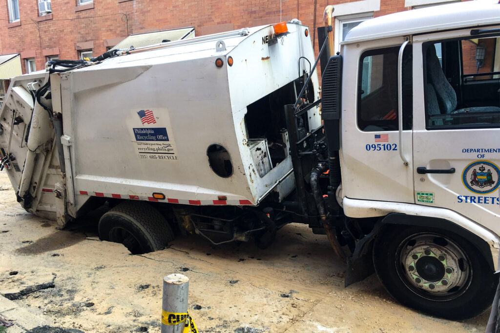 City recycling truck gets stuck in Port Richmond sinkhole