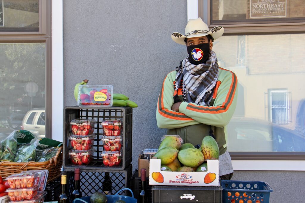 2020 09 19-e lee-derwood selby-philadelphia parrish street-new produce business hat Derwood Selby opened an outdoor market on Parrish Street near Corinthian Avenue in the Francisville section of Philadelphia, selling fresh produce and his signature olive oils and balsamic vinaigrettes.(Emma Lee/WHYY)