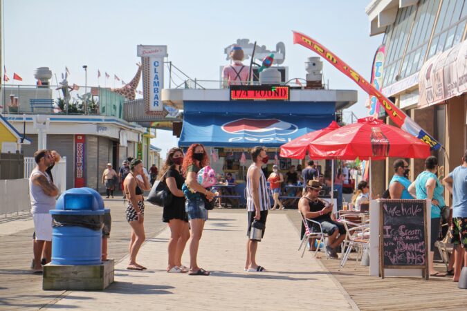 People line up outside a restaurant on the Seaside Heights boardwalk