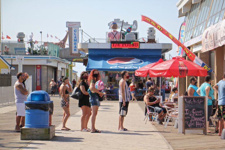 People line up outside a restaurant on the Seaside Heights boardwalk