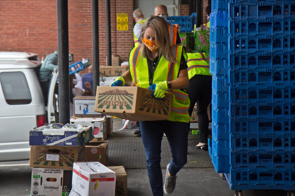 2020 9 11 k paynter philadbundance-6 Jane Clements-Smith, executive director of Feeding PA, helps load trucks at Philabundance’s South Philly location. (Kimberly Paynter/WHYY)