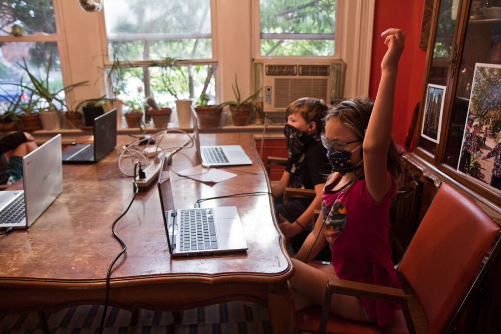 2020 9 18 k paynter pandemic school pods-6 Two kids at kitchen table, wearing masks during virtual learning