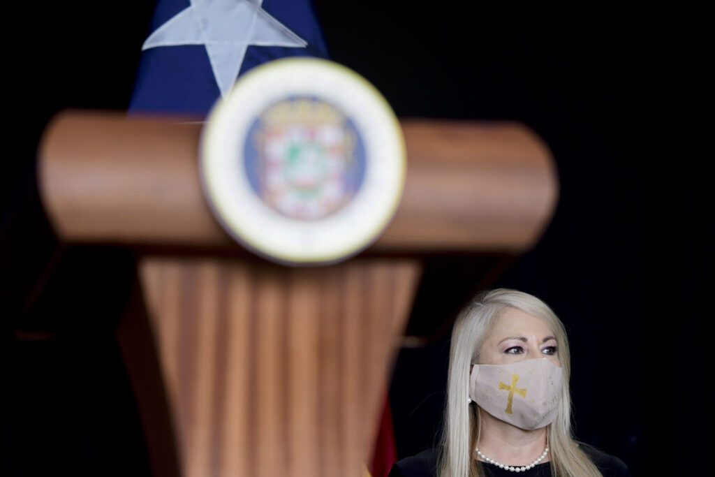 Wanda Vazquez FILE - In this May 21, 2020 file photo, Gov. Wanda Vazquez, wearing a protective face mask amid the new coronavirus pandemic, attends a press conference, in San Juan, Puerto Rico. Vazquez announced Wednesday, Aug. 19, 2020, that she will place the U.S. territory on a 24-hour lockdown every Sunday as part of stricter measures to fight a spike in COVID-19 cases. (AP Photo/Carlos Giusti, File)