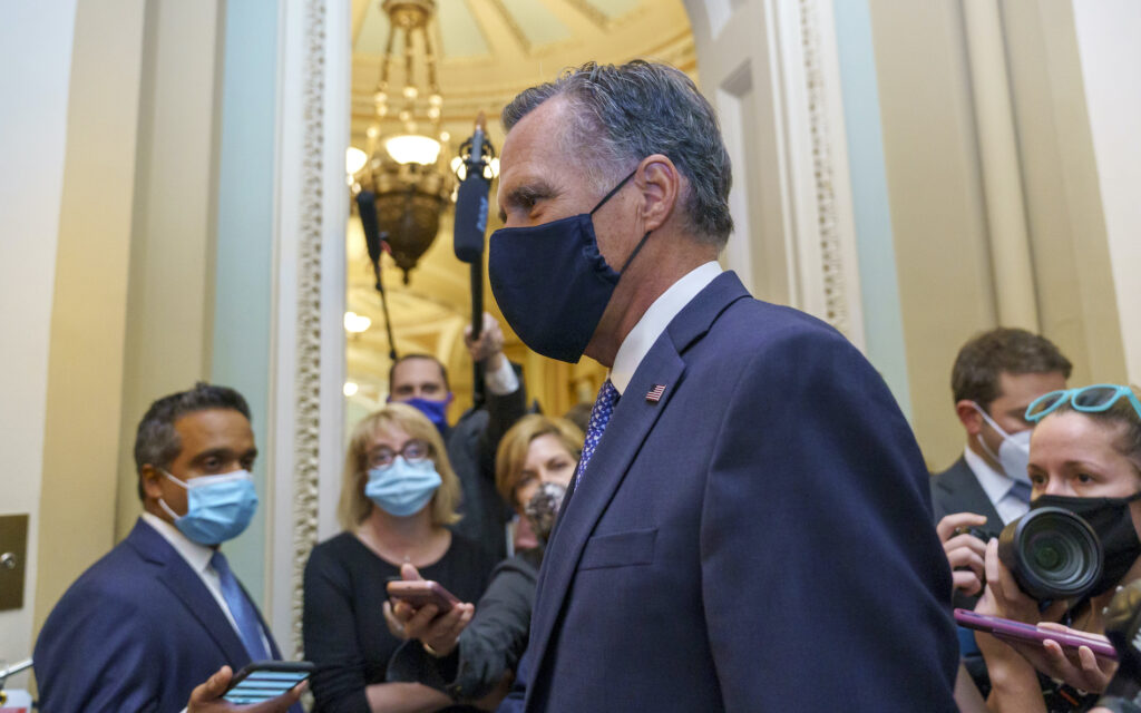 Mitt Romney Sen. Mitt Romney, R-Utah, tries to avoid reporters as he leaves the Senate Chamber following a vote, at the Capitol in Washington, Monday, Sept. 21, 2020. (AP Photo/J. Scott Applewhite)