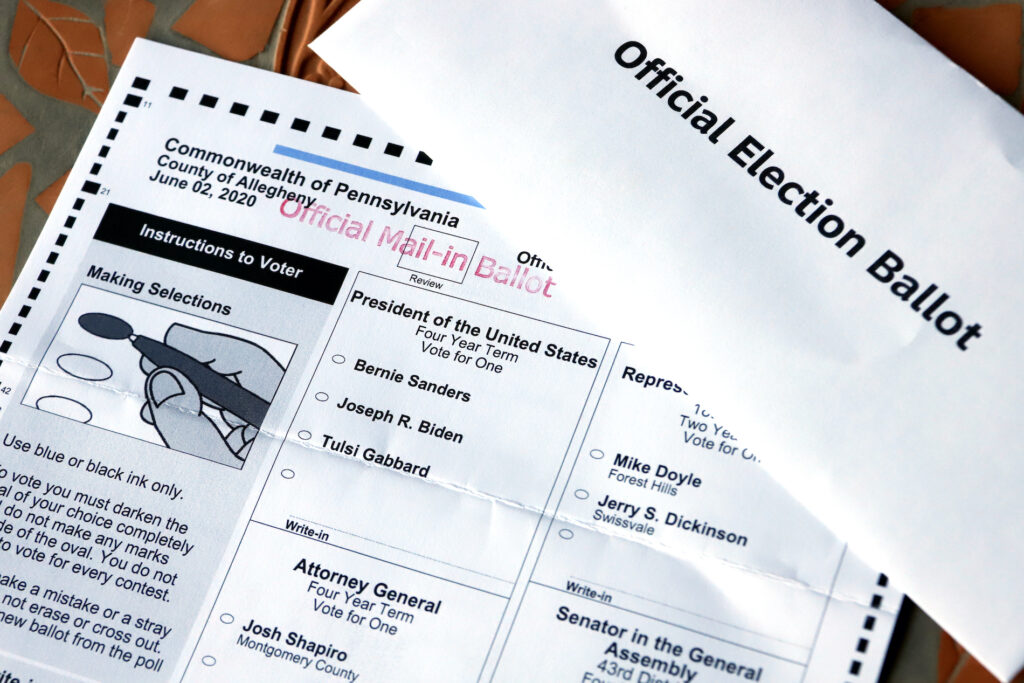 Election 2020 Awful Ovals This May 26, 2020, file photo shows an Official Democratic General Primary mail-in ballot and secrecy envelope, for the Pennsylvania primary in Pittsburgh. (AP Photo/Gene J. Puskar)