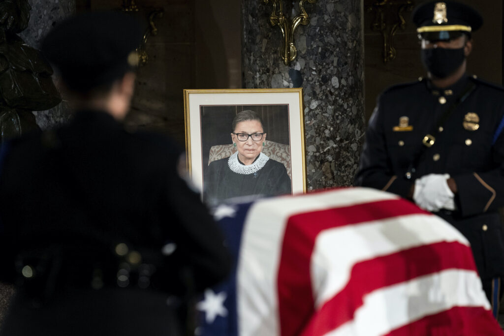 Supreme Court Ginsburg Lying in State The flag-draped casket of Justice Ruth Bader Ginsburg lies in state in the U.S. Capitol on Friday, Sept. 25, 2020. Ginsburg died at the age of 87 on Sept. 18 and is the first women to lie in state at the Capitol. (Erin Schaff/The New York Times via AP, Pool)