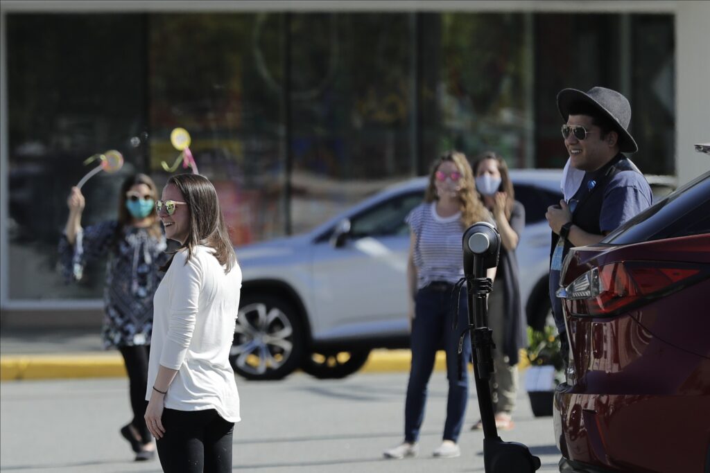 Virus Outbreak New Jersey Jenna Pelaez reacts as friends and loved ones sing