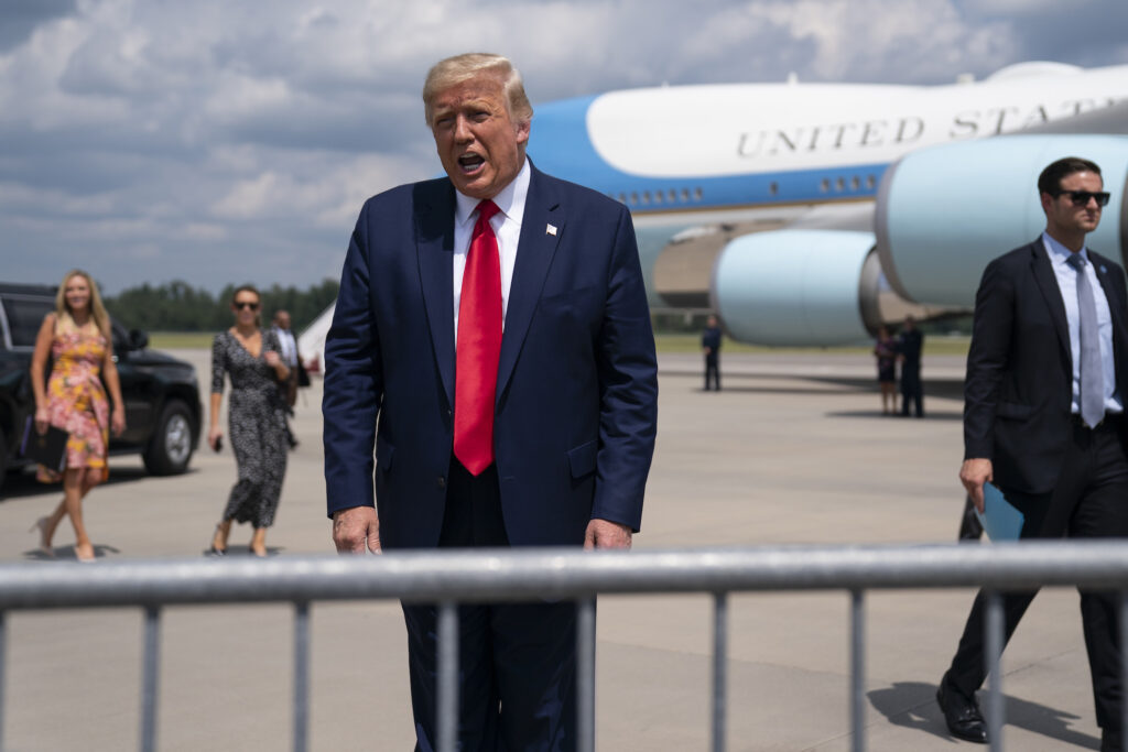 President Donald Trump talks to a crowd of supporters after arriving at Wilmington International Airport, Wednesday, Sept. 2, 2020, in Wilmington, N.C. (AP Photo/Evan Vucci)