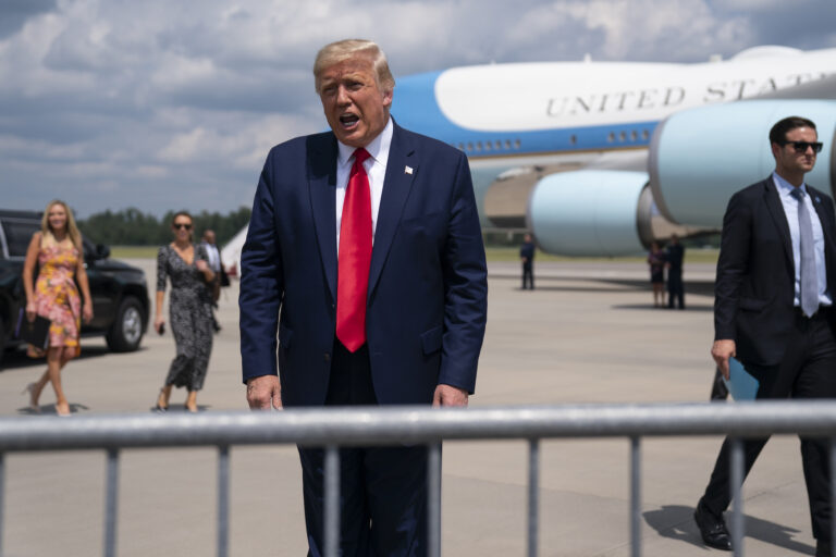 President Donald Trump talks to a crowd of supporters after arriving at Wilmington International Airport, Wednesday, Sept. 2, 2020, in Wilmington, N.C. (AP Photo/Evan Vucci)