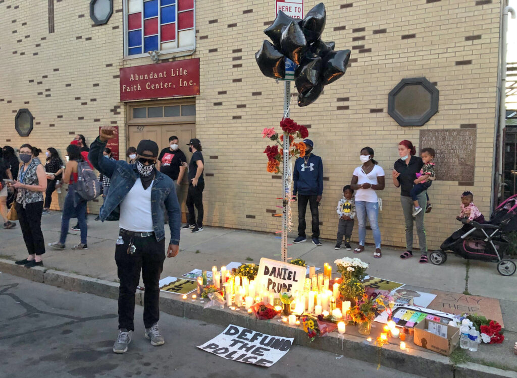 Rochester Police Death Protesters gather near a memorial to Daniel Prude at the site of his death, Thursday, Sept. 3. 2020 in Rochester, N.Y. Prude, a 41-year-old Black man, died March 30, 2020. His family took him off life support seven days after Rochester police officers encountered him running naked through the street, put a hood over his head to stop him from spitting, then held him down for about two minutes until he stopped breathing. (AP Photo/Ted Shaffrey)